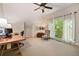 Office space with a desk, chair, and a bright window overlooking greenery at 4530 Upland Court, Cumming, GA 30040