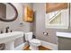 Powder room with a pedestal sink, and a wooden cabinet at 4530 Upland Court, Cumming, GA 30040