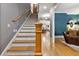 View of the staircase and entrance hall with hardwood floors and natural lighting at 4530 Upland Court, Cumming, GA 30040