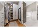 This closet features closet organizers and is adjacent to a soaking tub at 4530 Upland Court, Cumming, GA 30040