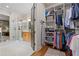 Walk-in closet that leads to the bathroom, with storage and shelving options at 4530 Upland Court, Cumming, GA 30040