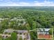 Aerial view of house and community with lots of trees at 5040 Meadow Lane Ne, Marietta, GA 30068