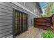 Back of house with doors leading to a wooden deck at 5040 Meadow Lane Ne, Marietta, GA 30068