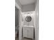 Bathroom featuring a white vanity with drawers, an oval mirror, and modern lighting at 5040 Meadow Lane Ne, Marietta, GA 30068