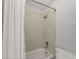 Bathroom featuring a shower with tile surround, a toilet, and a shower curtain at 5040 Meadow Lane Ne, Marietta, GA 30068