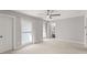 Spacious bedroom boasts neutral tones, ceiling fan and lots of natural light at 5040 Meadow Lane Ne, Marietta, GA 30068