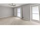 Bright bedroom with neutral carpet and light-colored walls at 5040 Meadow Lane Ne, Marietta, GA 30068