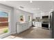 Bright kitchen featuring white cabinets, granite countertops, and stainless steel appliances at 5040 Meadow Lane Ne, Marietta, GA 30068