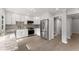 Modern kitchen with white cabinetry, stainless steel appliances, and stylish granite countertops at 5040 Meadow Lane Ne, Marietta, GA 30068