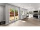 Bright kitchen featuring white cabinets, stainless steel appliances, and a large window at 5040 Meadow Lane Ne, Marietta, GA 30068