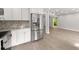 Updated kitchen featuring sleek stainless steel refrigerator and updated cabinets and countertops at 5040 Meadow Lane Ne, Marietta, GA 30068