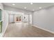 Spacious living room with wood flooring and access to the kitchen and backyard at 5040 Meadow Lane Ne, Marietta, GA 30068