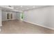 Bright and spacious living room features new wood floors and french doors to patio at 5040 Meadow Lane Ne, Marietta, GA 30068