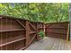 Wooden patio with privacy fence is perfect for relaxing at 5040 Meadow Lane Ne, Marietta, GA 30068