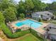 Overhead community pool view with plenty of lounge chairs and shade at 5040 Meadow Lane Ne, Marietta, GA 30068