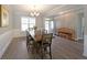 Bright dining room features wood floors, large windows, and a decorative chandelier at 686 Stark St, Lawrenceville, GA 30046