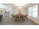 Elegant dining room with hardwood floors, natural light, and a stylish chandelier at 686 Stark St, Lawrenceville, GA 30046