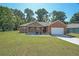 Beautiful single-story brick home featuring an attached two-car garage and well-manicured lawn at 686 Stark St, Lawrenceville, GA 30046