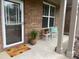 Welcoming front porch with red brick and seating area at 686 Stark St, Lawrenceville, GA 30046
