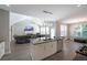 Open concept kitchen with island and stainless steel appliances, flowing into the living area at 686 Stark St, Lawrenceville, GA 30046