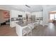 Modern kitchen with white cabinets, stainless steel appliances, and an island with seating at 686 Stark St, Lawrenceville, GA 30046