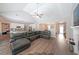 Spacious living room features hardwood floors, vaulted ceilings and a large sectional sofa at 686 Stark St, Lawrenceville, GA 30046