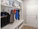 Well-organized mudroom area with built-in bench, hooks, and shelving near the entrance at 686 Stark St, Lawrenceville, GA 30046
