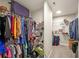 Organized walk-in closet with extensive shelving, hanging rods, and ample storage space at 686 Stark St, Lawrenceville, GA 30046