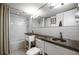 Modern bathroom with dual sinks, subway tile, and a large mirror for a bright, airy feel at 130 26Th Nw St # 701, Atlanta, GA 30309