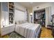 Well-lit bedroom featuring a pull down murphy bed and a walk-in closet at 130 26Th Nw St # 701, Atlanta, GA 30309