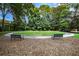 Landscaped common area with walking path, park benches and mature trees at 130 26Th Nw St # 701, Atlanta, GA 30309