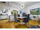 Dining area featuring modern chairs, a round table, and an open layout to the kitchen at 130 26Th Nw St # 701, Atlanta, GA 30309