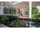 Well-maintained building entrance with a calming koi pond and inviting water feature at 130 26Th Nw St # 701, Atlanta, GA 30309