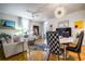 Well-lit living room with dining area offering a comfortable and stylish living space at 130 26Th Nw St # 701, Atlanta, GA 30309