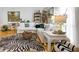 Bright living room showcasing a modern sectional sofa and a unique zebra-striped rug at 130 26Th Nw St # 701, Atlanta, GA 30309