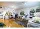 Open-concept space featuring a dining area, living room, and kitchen with warm hardwood floors at 130 26Th Nw St # 701, Atlanta, GA 30309