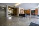 A well lit and stylish lobby with granite floors, decorative lighting, and comfortable seating at 130 26Th Nw St # 701, Atlanta, GA 30309