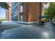 Outdoor seating area features tables with umbrellas at 130 26Th Nw St # 701, Atlanta, GA 30309