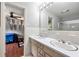 Bathroom features a double sink vanity and a doorway view into the bedroom at 1533 High Haven Ne Ct, Atlanta, GA 30329