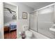 Bathroom featuring a bathtub with a glass shower door and access to the bedroom at 1533 High Haven Ne Ct, Atlanta, GA 30329