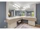 Dual-sink vanity area in a spacious bathroom, offering ample counter space and storage, illuminated by stylish lighting at 1533 High Haven Ne Ct, Atlanta, GA 30329