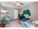 Charming bedroom featuring a gaming-themed decor, comfortable furnishings, and playful accents at 1533 High Haven Ne Ct, Atlanta, GA 30329