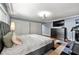 Spacious bedroom with hardwood floors, ceiling fan, TV, dresser, and a treadmill at 1533 High Haven Ne Ct, Atlanta, GA 30329