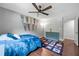 Bedroom with hardwood floors, ceiling fan, dresser and sport pennants on the wall at 1533 High Haven Ne Ct, Atlanta, GA 30329