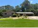Charming ranch-style home featuring a well-manicured lawn and beautiful landscaping at 1533 High Haven Ne Ct, Atlanta, GA 30329