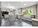Modern kitchen with granite countertops, gray cabinets, stainless-steel appliances, and a breakfast nook at 1533 High Haven Ne Ct, Atlanta, GA 30329