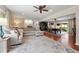 Spacious living room with a ceiling fan and sliding doors to the backyard at 1533 High Haven Ne Ct, Atlanta, GA 30329