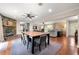 Open floor plan with a stone fireplace, dining area, and access to the living room at 1533 High Haven Ne Ct, Atlanta, GA 30329