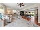 Open-concept living room with dining area, hardwood floors, neutral colors, and a seamless flow at 1533 High Haven Ne Ct, Atlanta, GA 30329