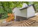 View of the backyard with stairs and a deck on a two-story house at 2599 Willow Creek Dr, Duluth, GA 30096